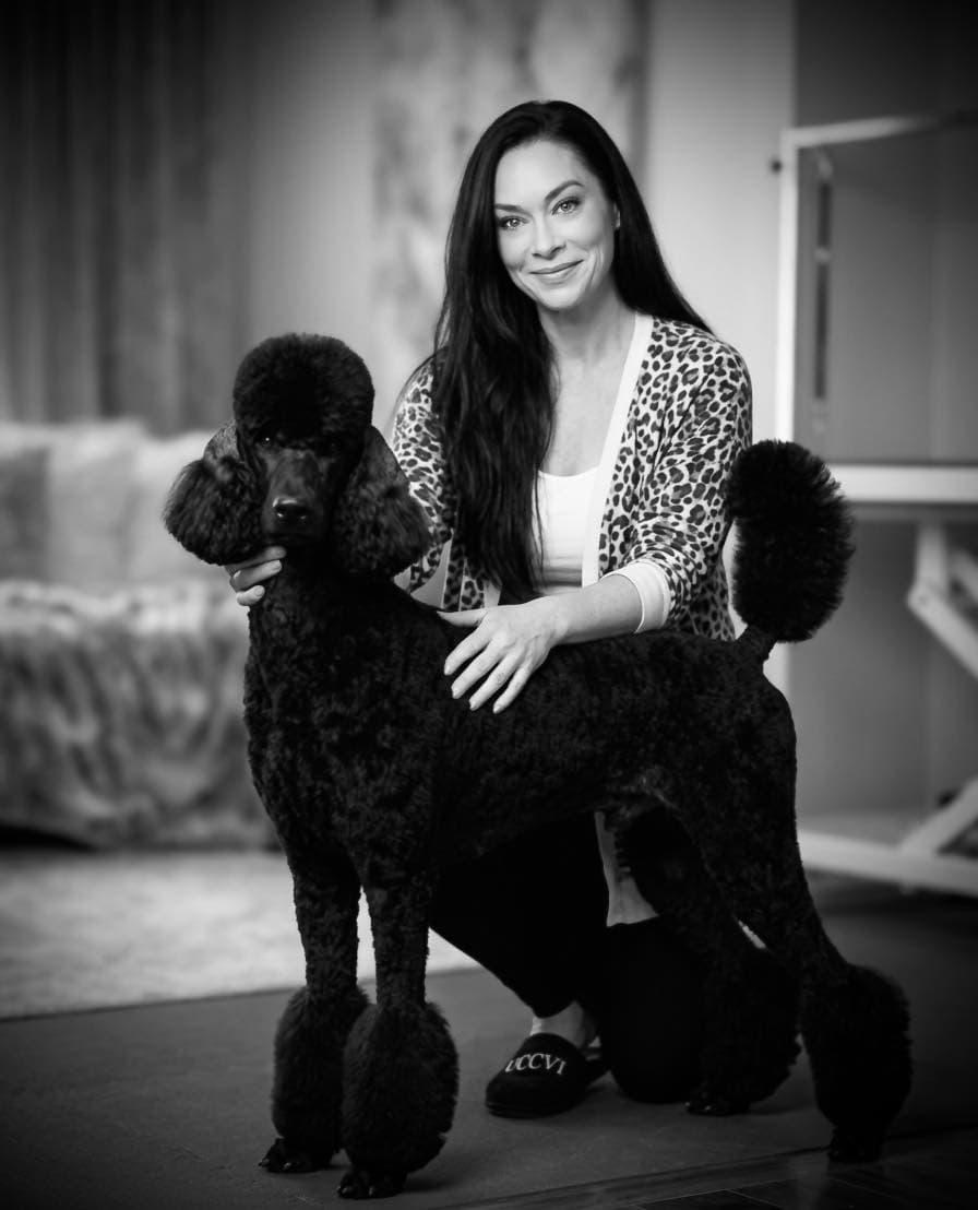 LilaJean, Nationally Certified Master Groomer, with a beautifully groomed standard poodle at The Paw Queen in Boulder City, NV